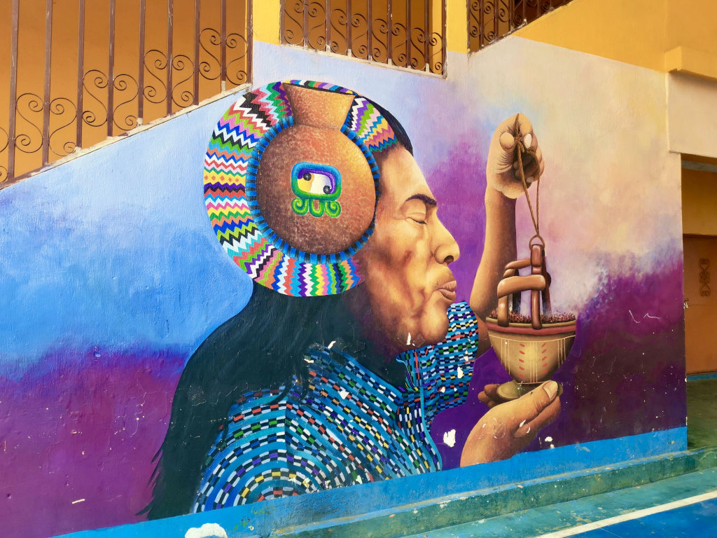 Colorful street art next to a basketball court in San Juan La Laguna 