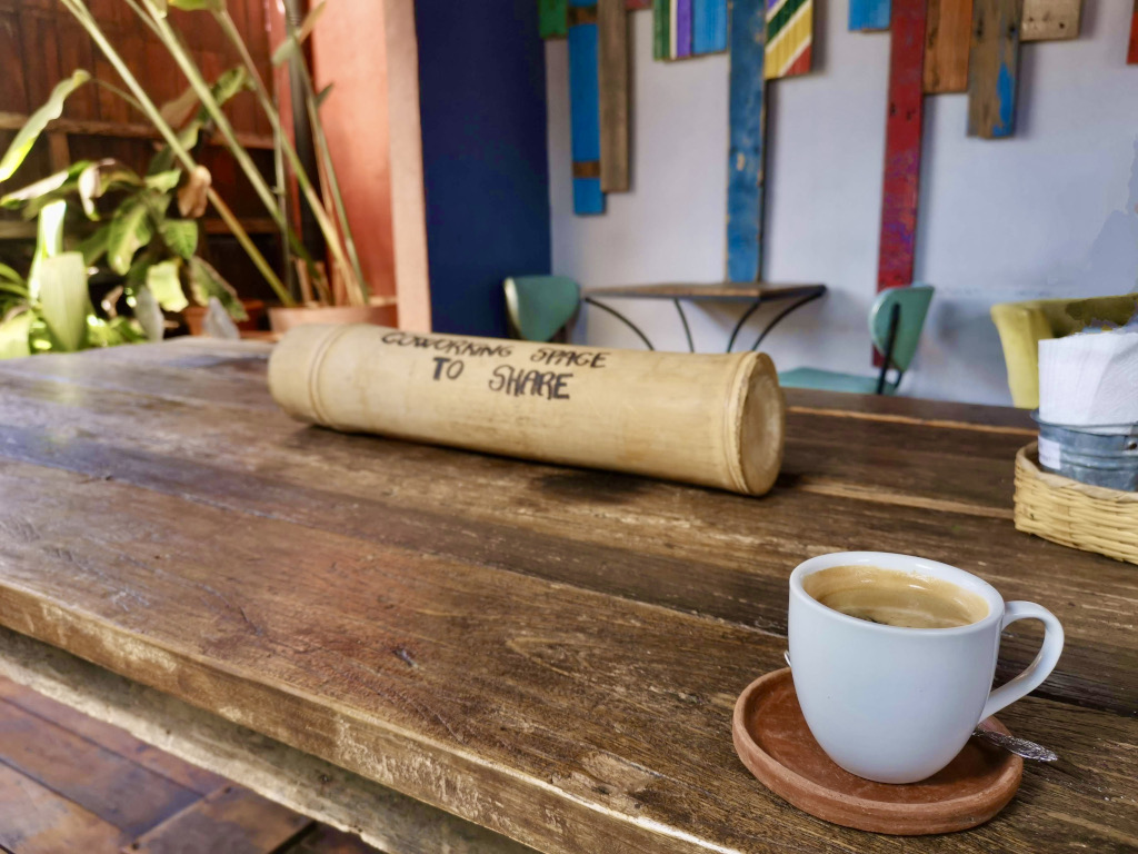 A cup of coffee sitting on a table at Cafe Boheme one of the best cafes Antigua Guatemala has to offer