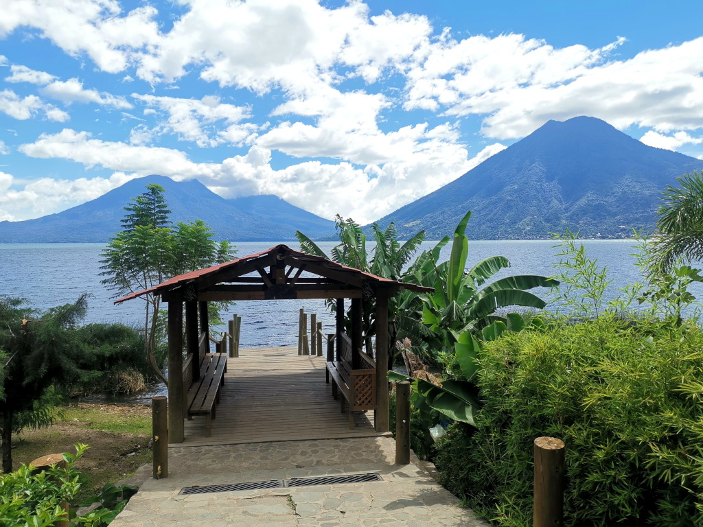 The boat dock of San Marcos La Laguna with volcanos in the background