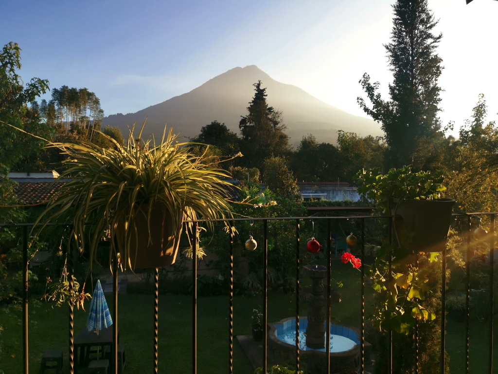 View from an Airbnb balcony in Antigua Guatemala towards a volcano