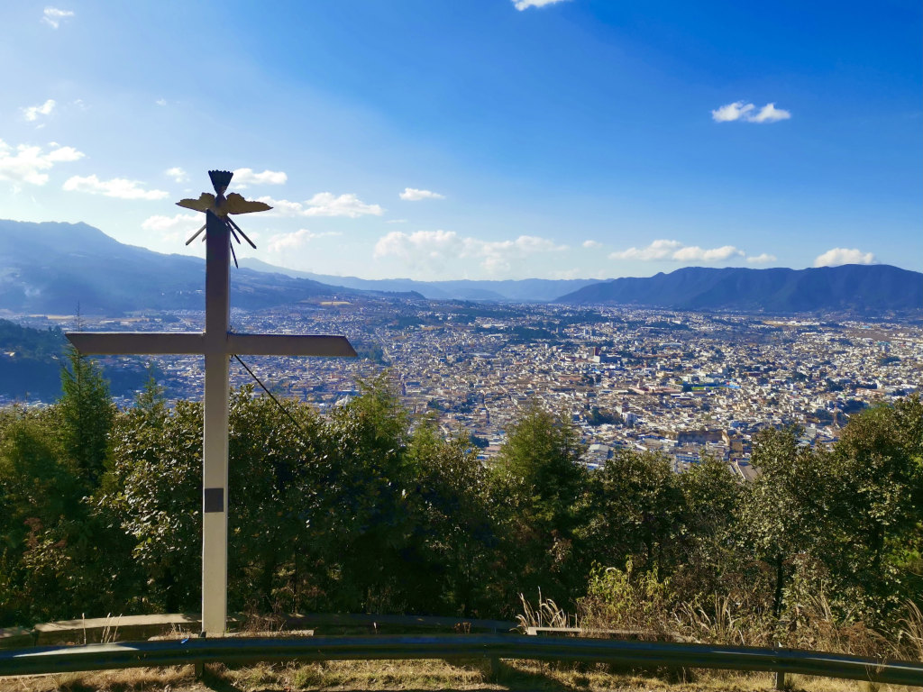 Quetzaltenango from the top with a mountain cross in the foreground