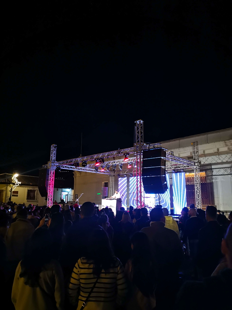 A DJ performing on a stage at Antigua's main square on New Year's Eve
