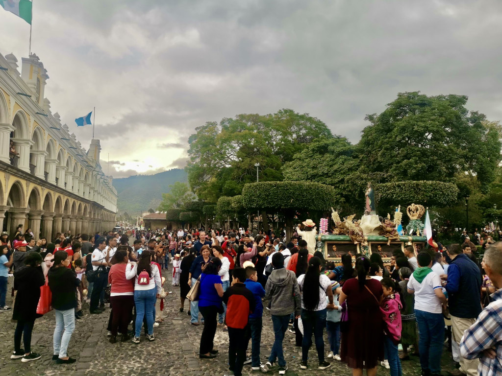 Locals gathering in the streets for the for the Fiesta de la Virgen de Guadalupe celebration during Christmas in Antigua Guatemala