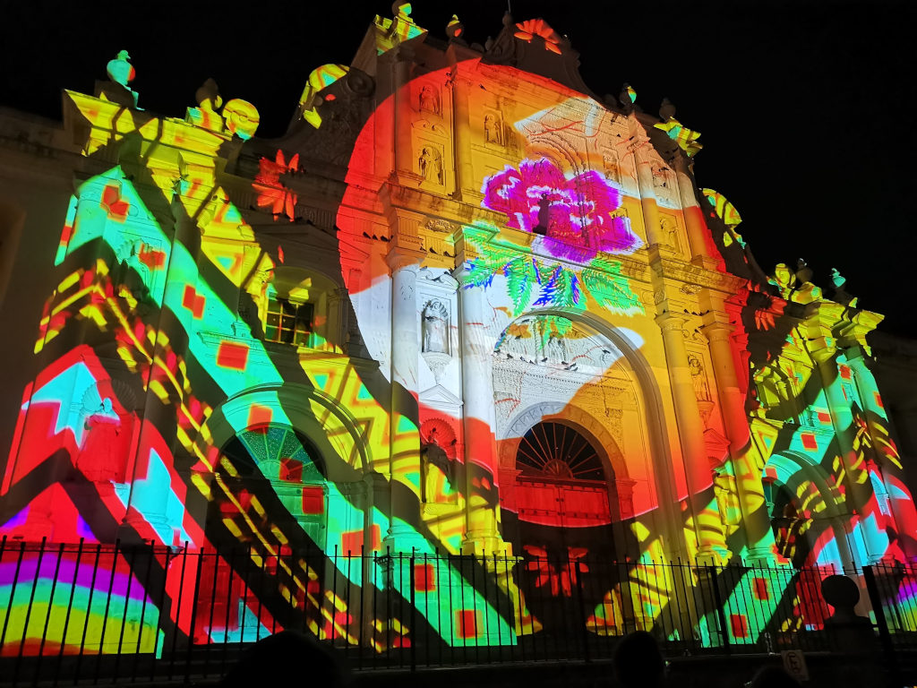 A church covered in a light show for New Years Antigua Guatemala