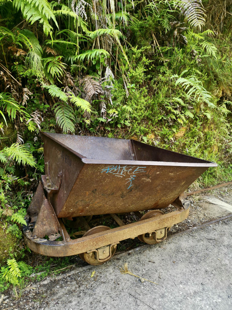 A gold mining car at the side of the road