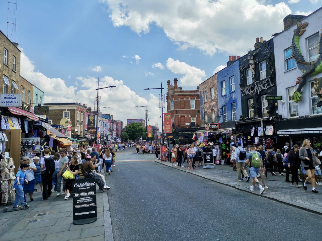 A busy street full of pedestrians in camden a great stop on a london itinerary