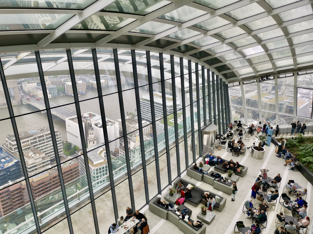 People sitting in the sky garden in london one of the best free things to do in london