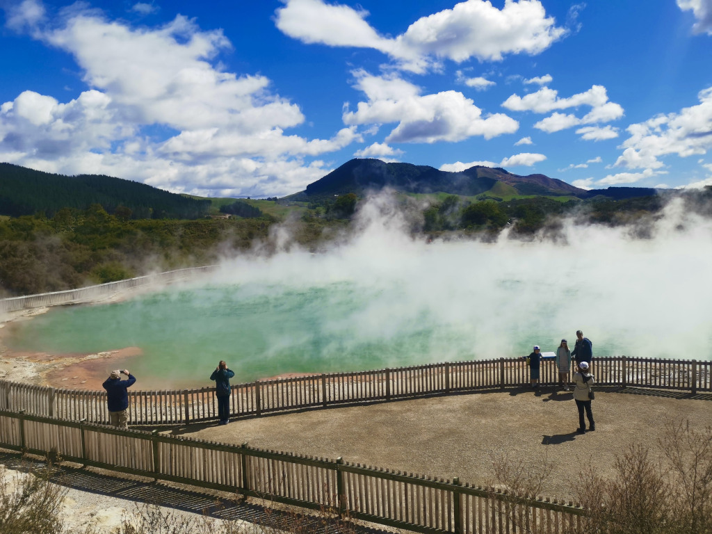 People looking at the champagne pool at waiotapu thermal reserve one of the best things to do in one day in rotorua