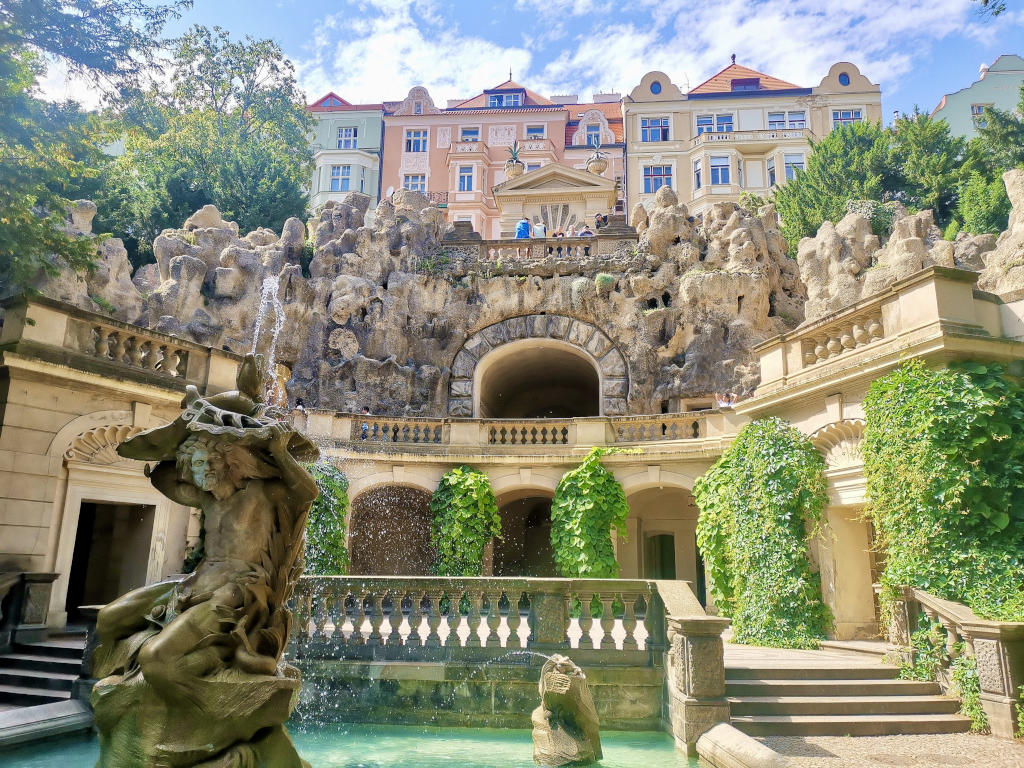 The Grotta in Prague, a beautiful area in a park with a fountain and a man made cave