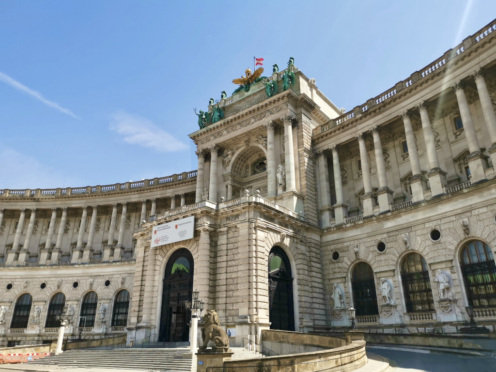 A large semi circular historical building called the hofburg in vienna a great place to staop during 2 days in vienna