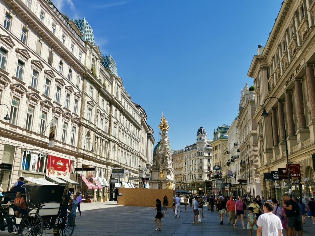 People walking down the main shopping street in downtown Vienna