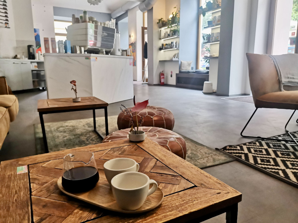 Two coffee cups on a table in a cafe in vinohrady prague