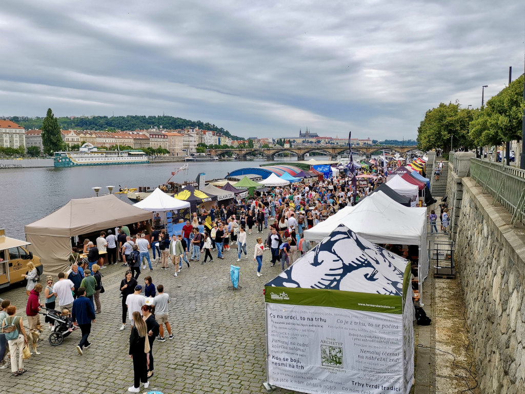 A crowd of people at farmers market in Prague