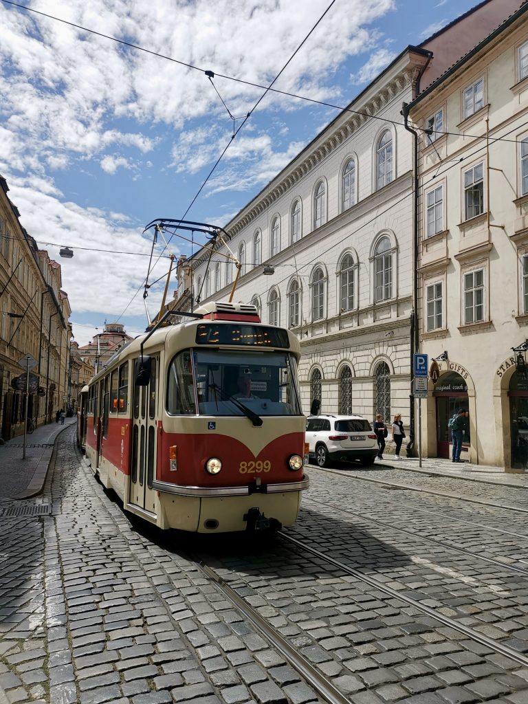 An old tram going down the street in the mala strana in prague czech republic