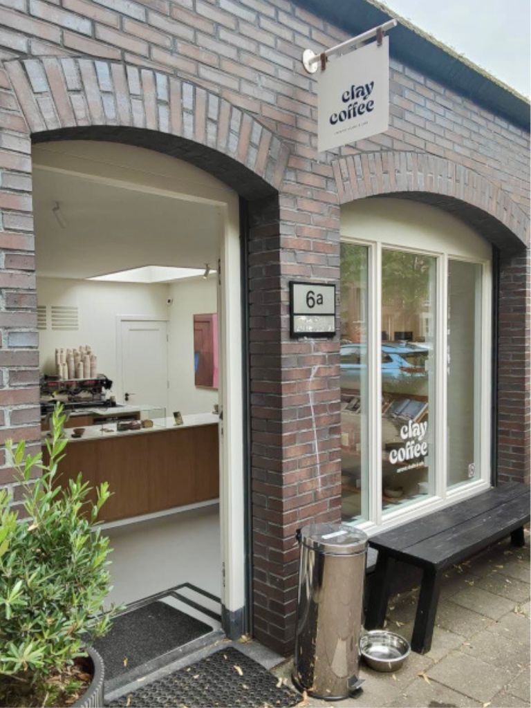 The brick-walled entrance to Clay Coffee, one of the best lesser known Amsterdam cafes.