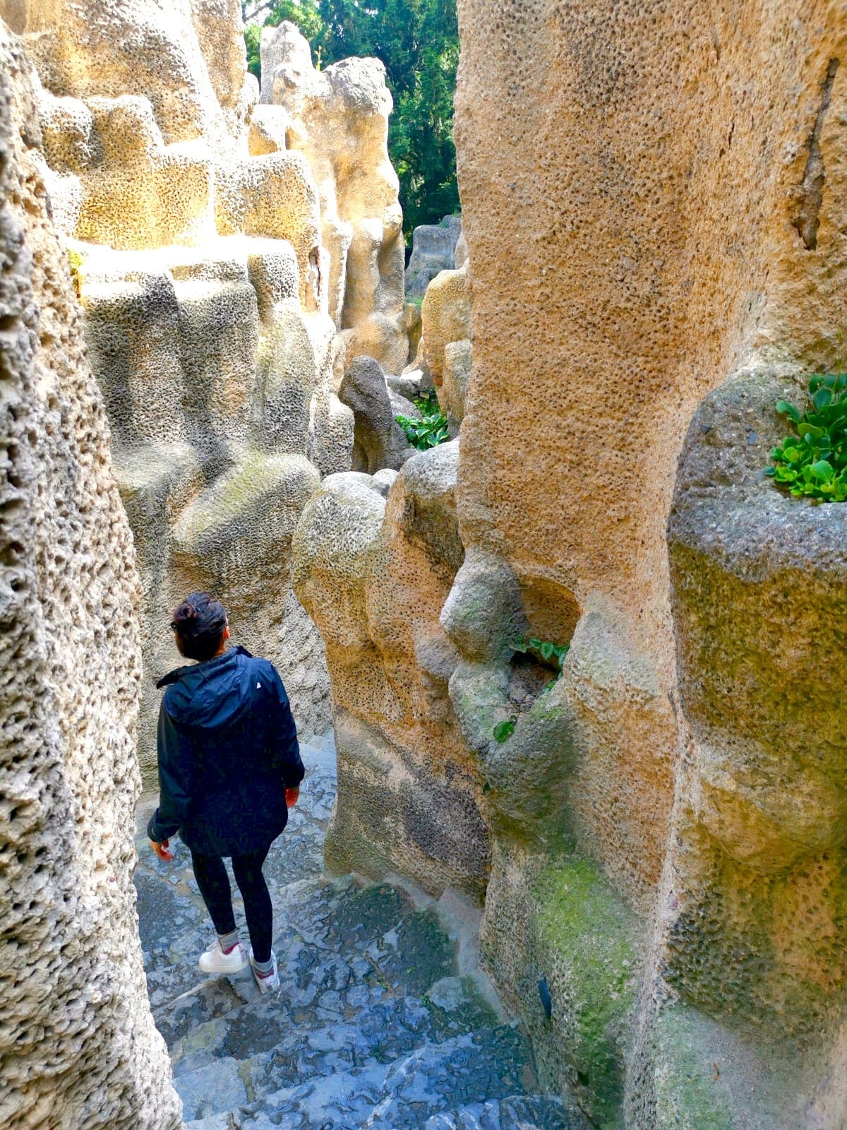 Katharina walking through the grotto in Vinohrady, Prague.