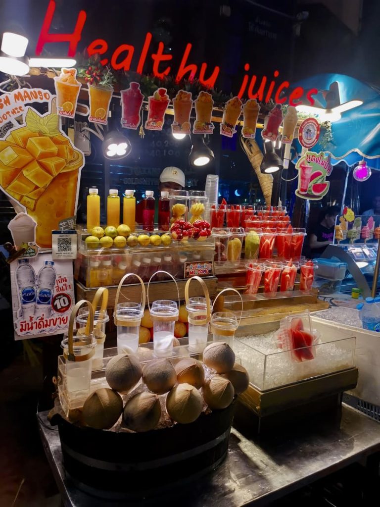 A food cart selling fruit smoothies on the main street in Bangkok's Chinatown.