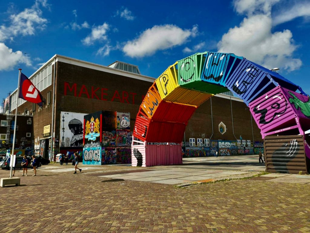 A street art display on the exterior of an old warehouse in north amsterdam