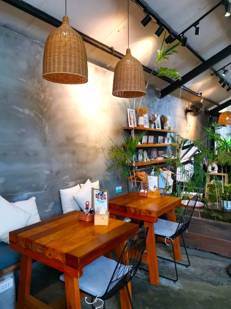 The seating area of Nourish Eatery, one of the best cafes in Hoi An for coffee and healthy food.